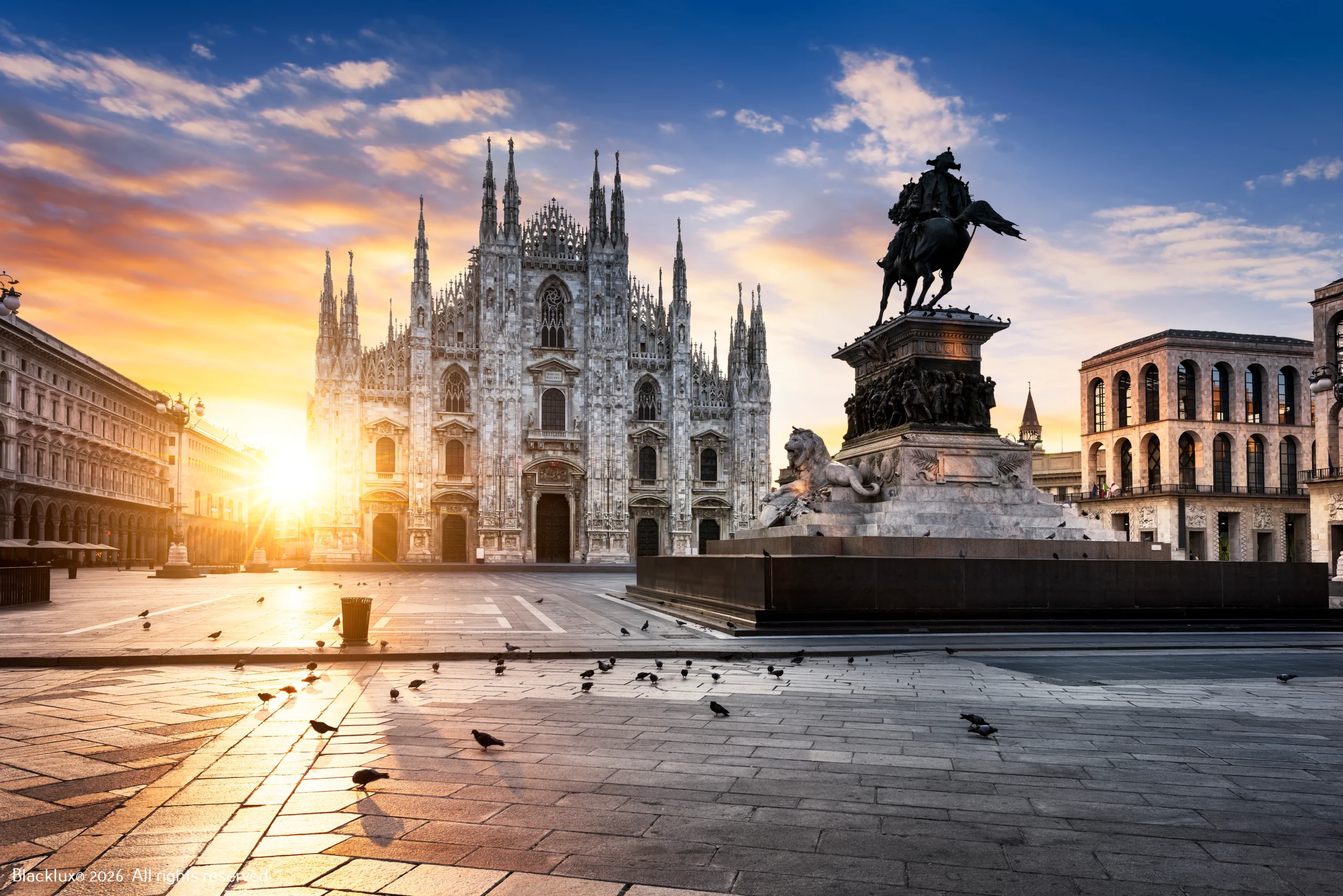 Milan Cathedral and the equestrian monument in Piazza del Duomo with low golden light