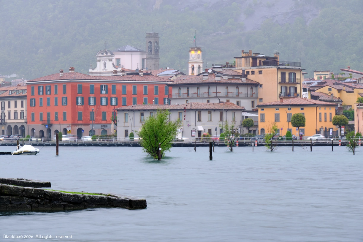 Colourful waterfront buildings facing calm lake water