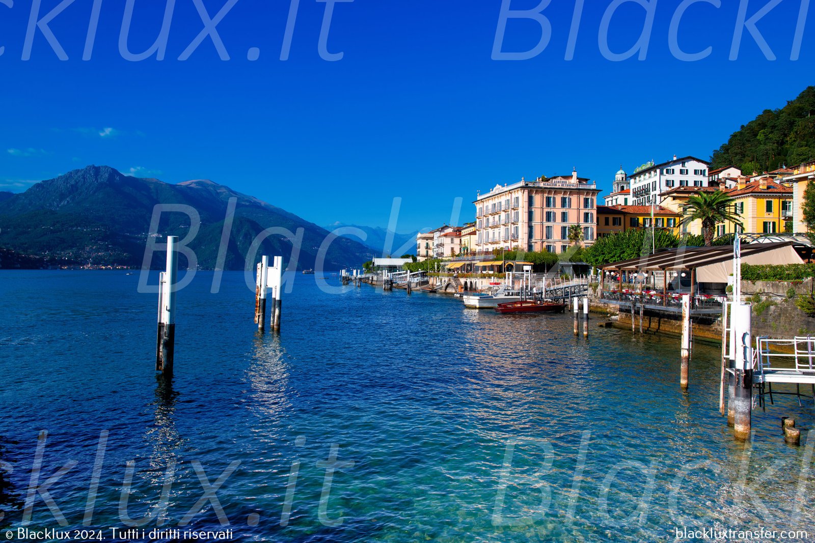 Bellagio waterfront with pastel hotel façades, mooring posts and blue lake water