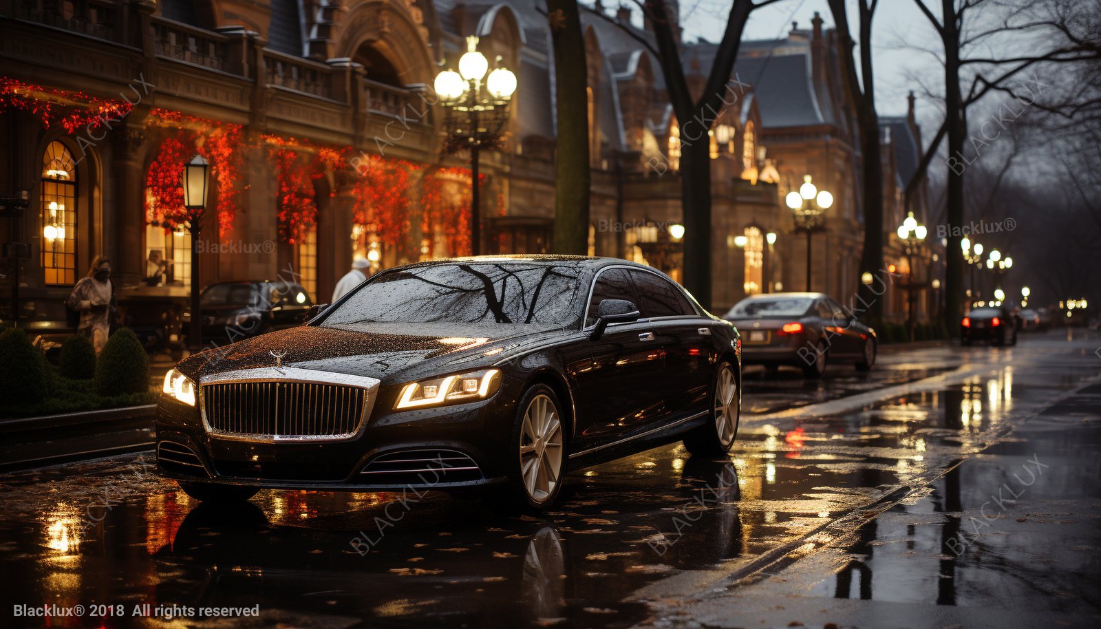 Black sedan on a wet city street beside warmly lit buildings at dusk
