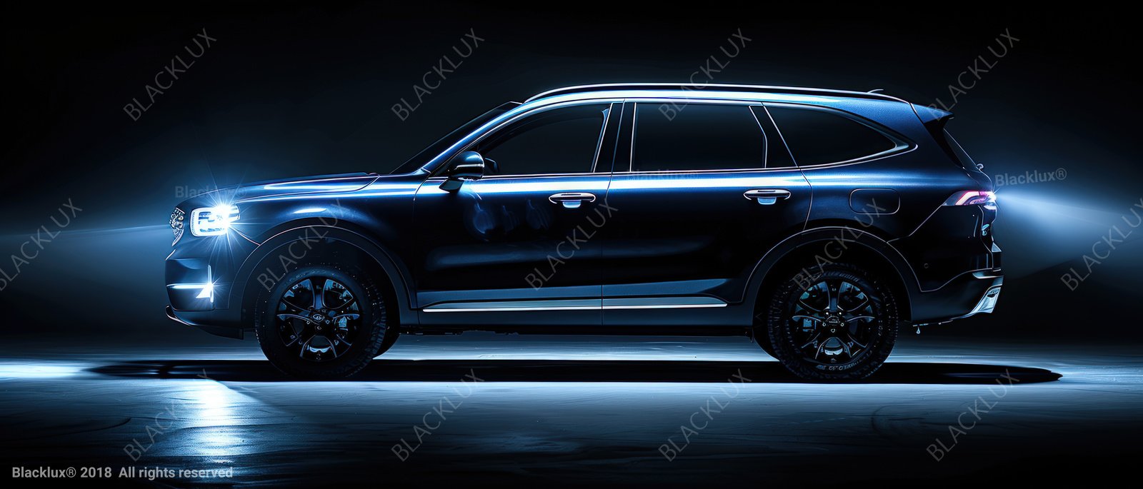 Side view of a glossy black SUV outlined by cool blue studio light against a dark background